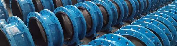 Resilient Seated or Metal Seated Gate Valves: blue flanged rubber expansion joints stacked in the mic valve finished goods store