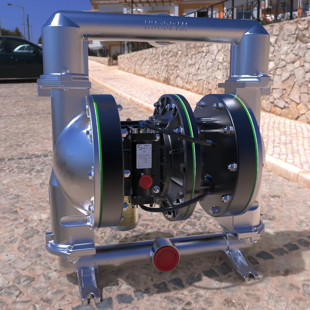 Stainless steel double diaphragm pump sitting outdoors on a cobblestone surface