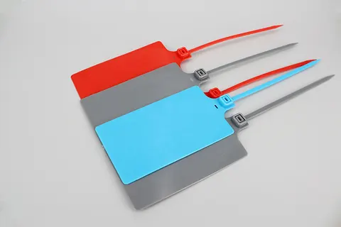 Precinto de seguridad DM-4*255MKT en material PP con etiqueta marcadora grande