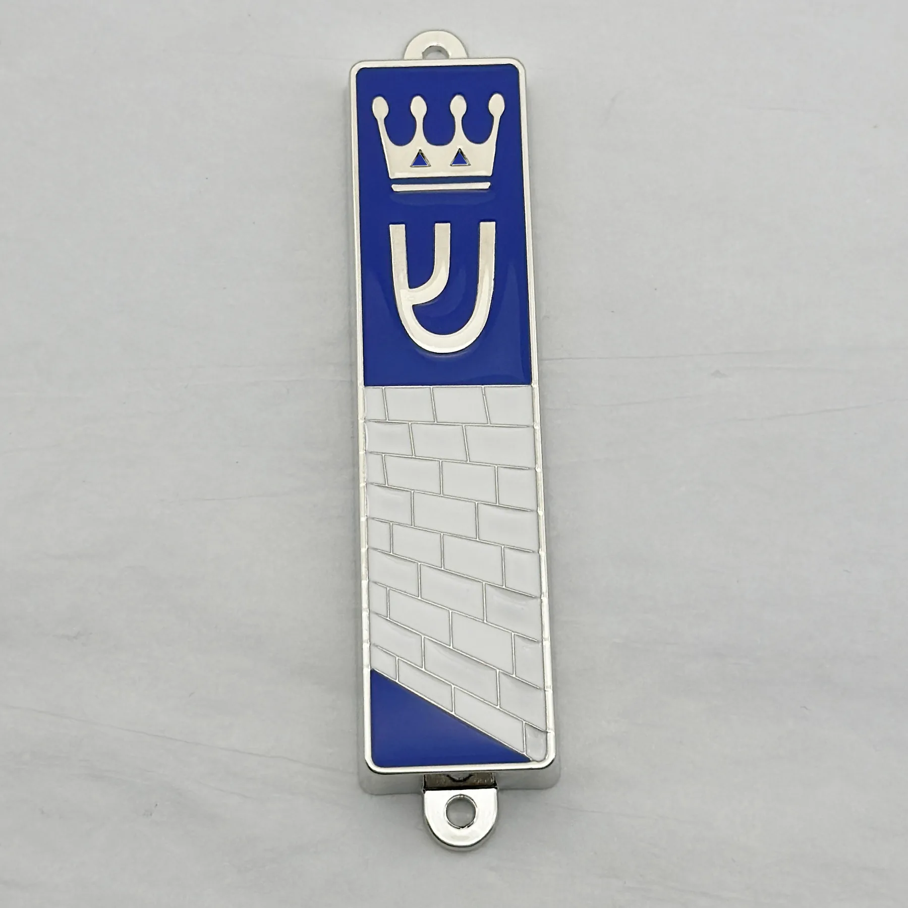 Close view of the blue enamel work on the mezuzah case
