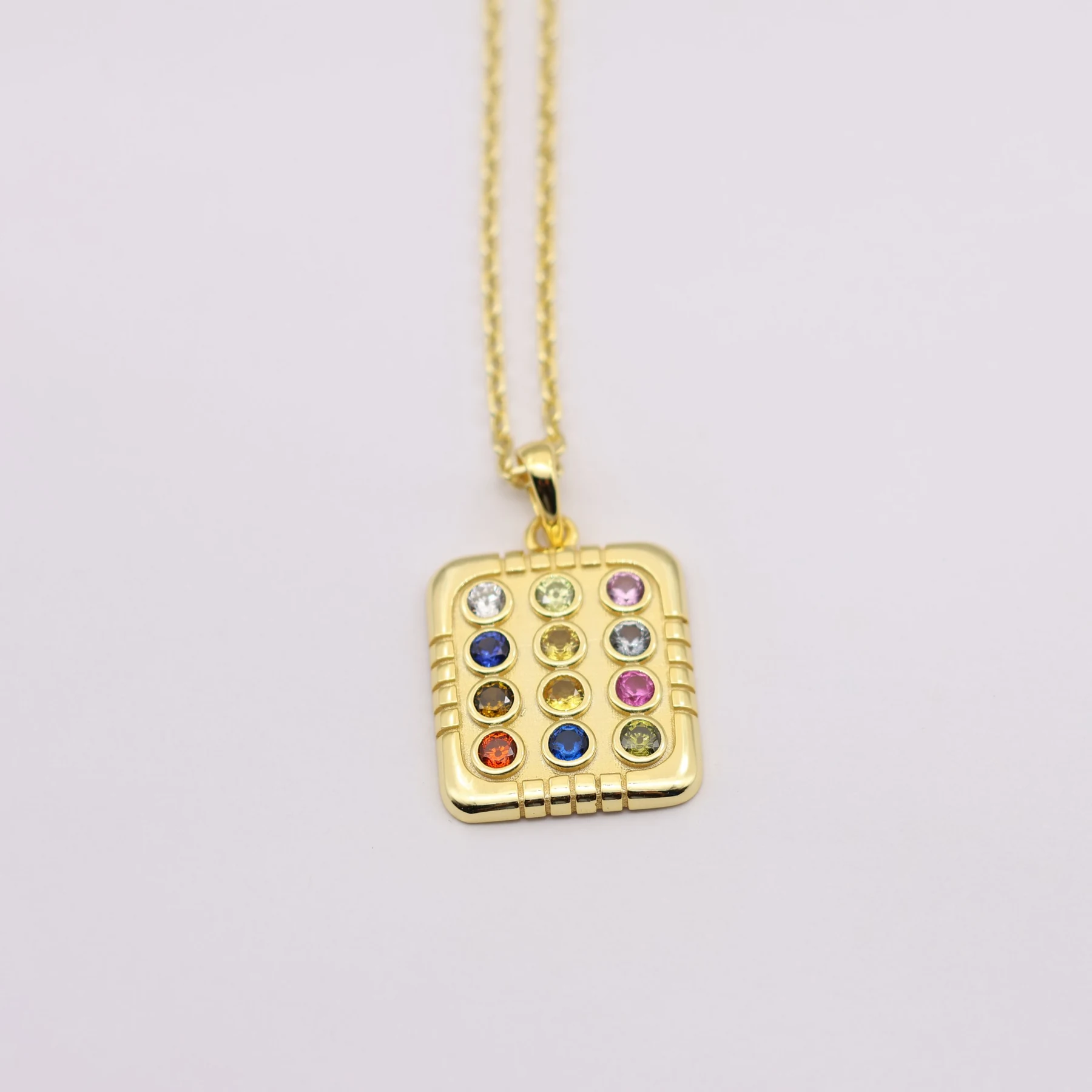 Close view of the twelve set gemstones on the breastplate charm