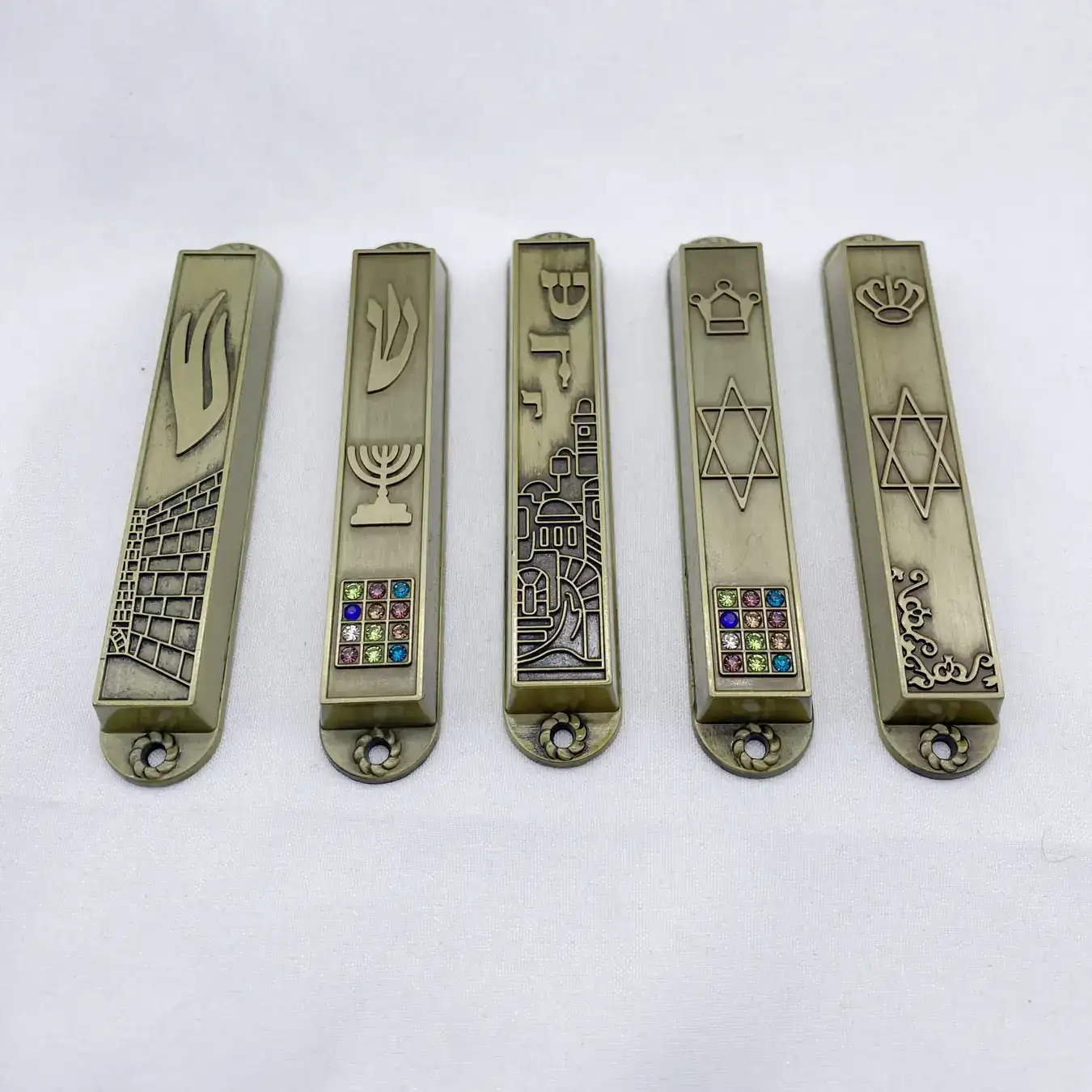 Close view of the symbols on the antique bronze mezuzahs