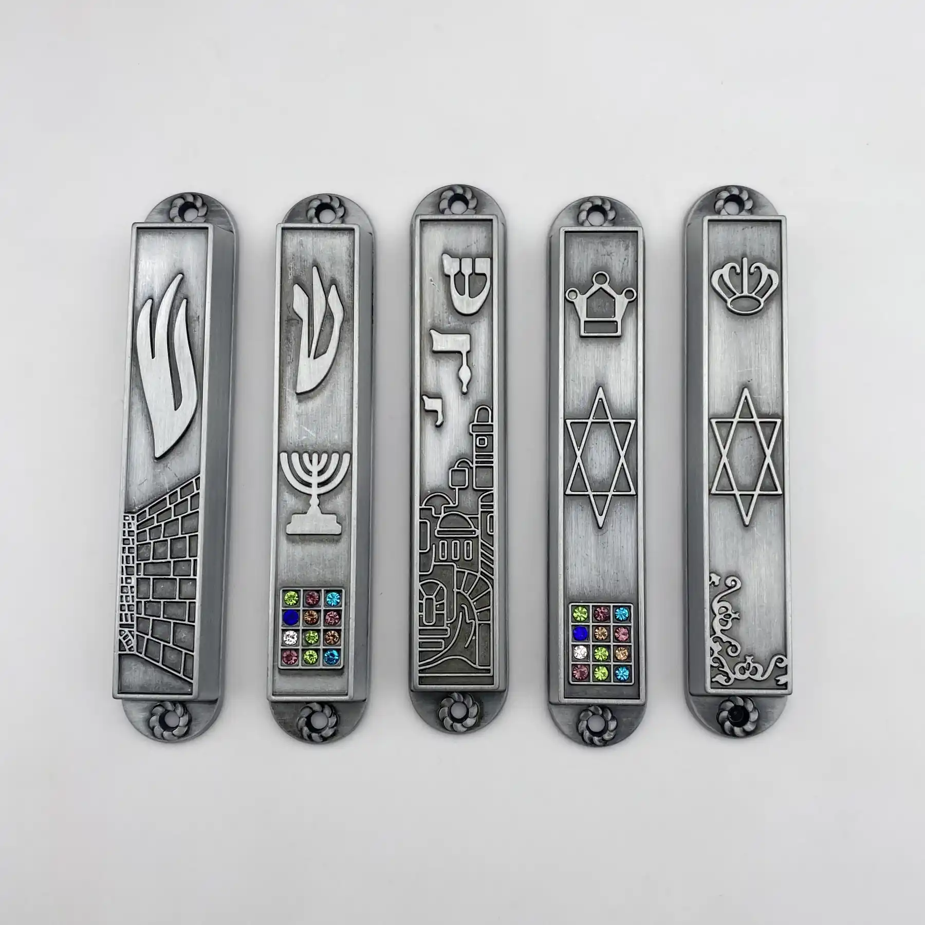 Antique bronze mezuzah set shown laid out
