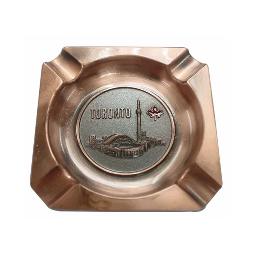 Antique plated metal cigar ashtray with cast design