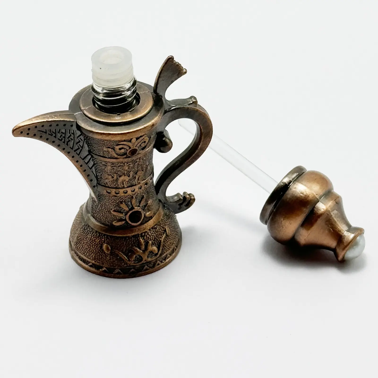 Close view of the cast metal collar and cap on the perfume bottle