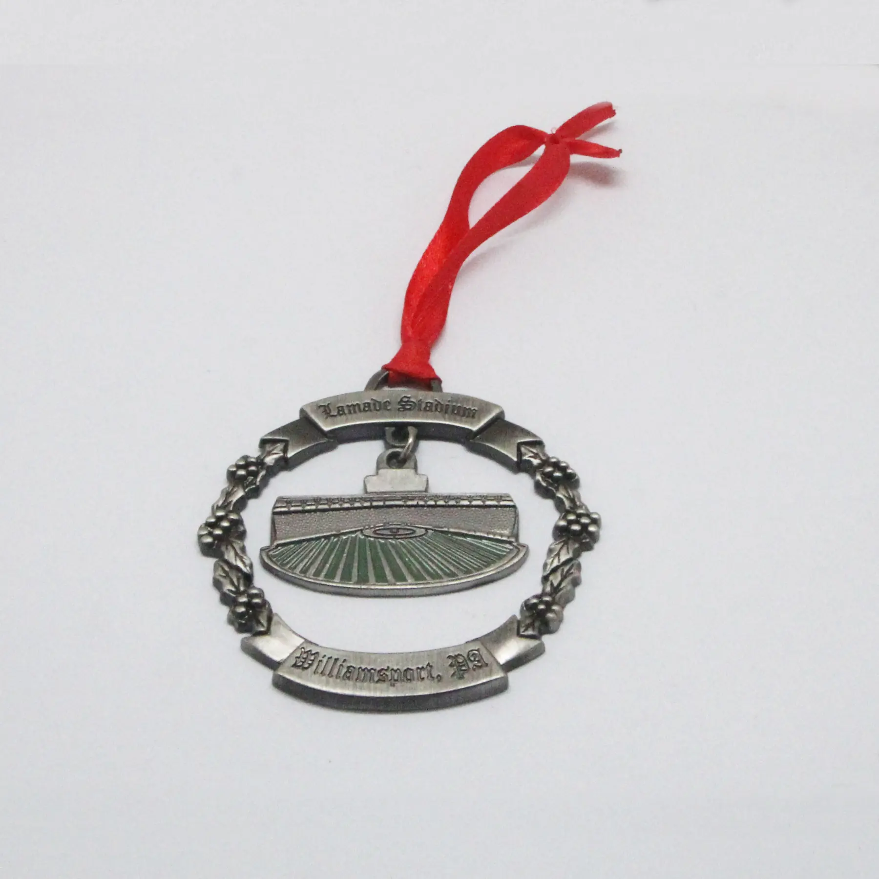 Close view of the enamel work on the metal Christmas ornament