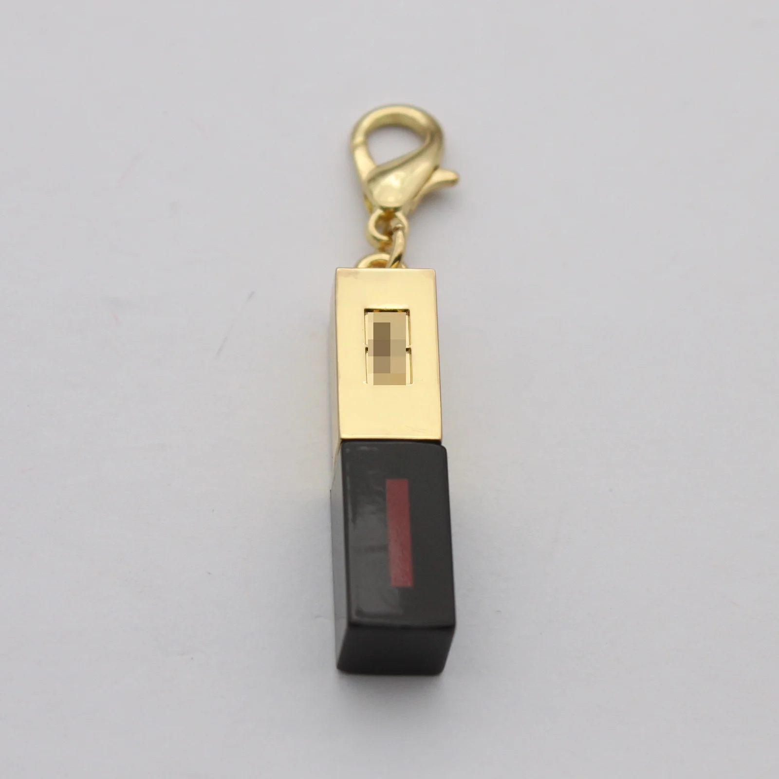Custom mini lipstick charm shown from the front