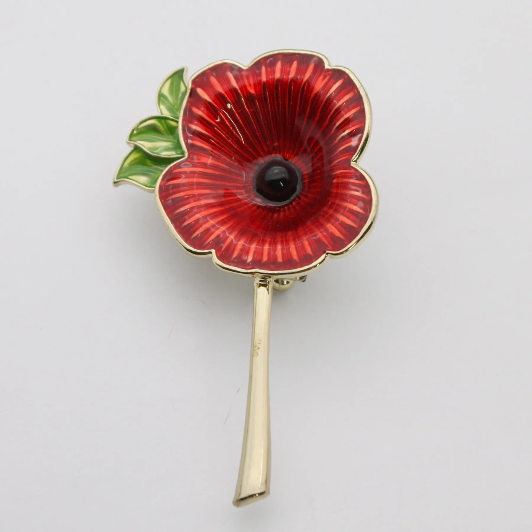 Reverse of the poppy lapel pin showing the pin fitting