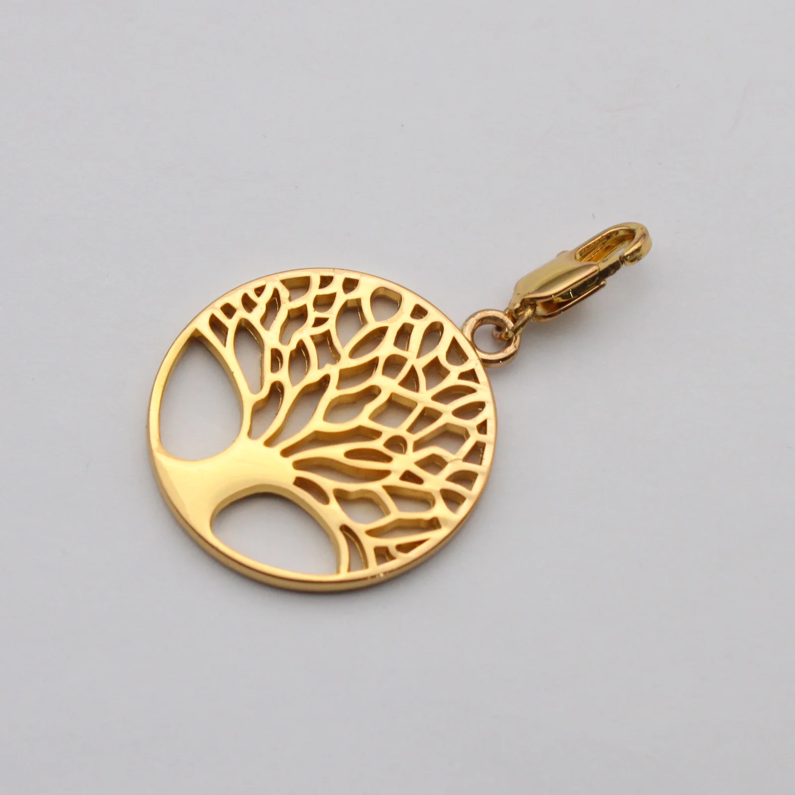 Close view of the cast branch detail on the Tree of Life charm