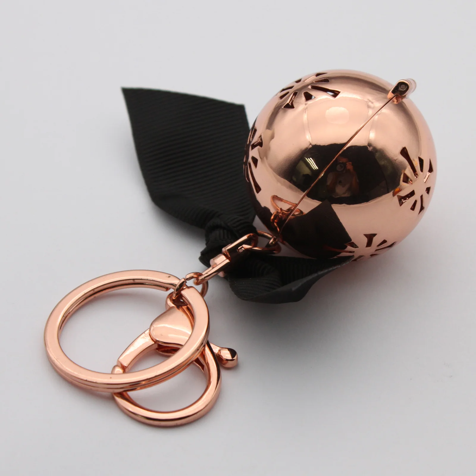 Diffuser keyring shown opened at the magnetic closure