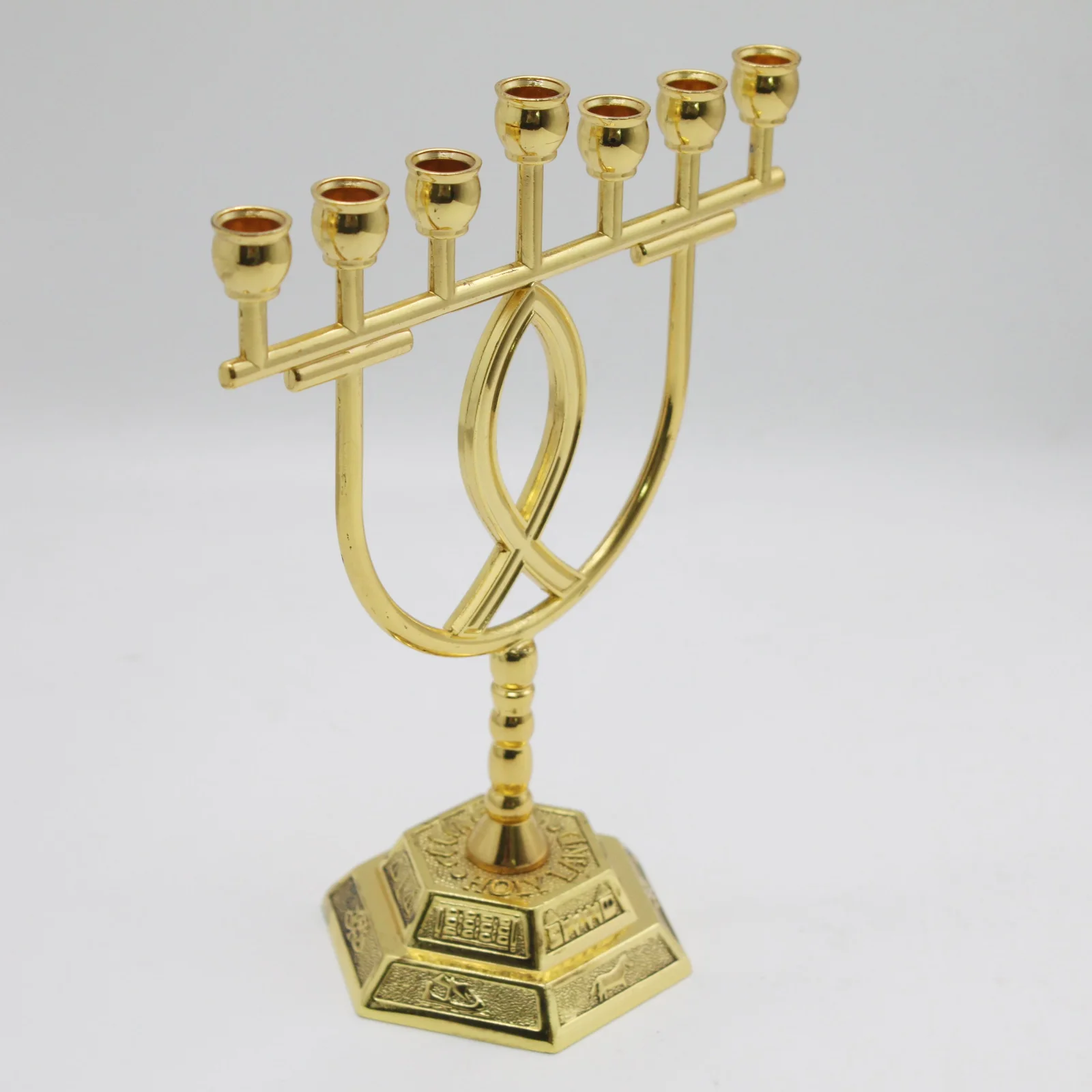 Close view of the fish symbol on the gold plated menorah