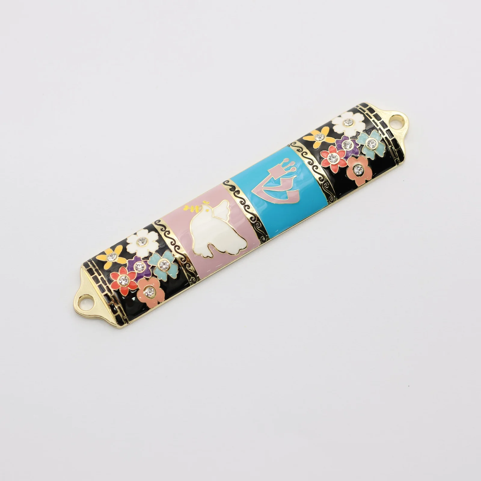 Flower and pigeon mezuzah shown from the front