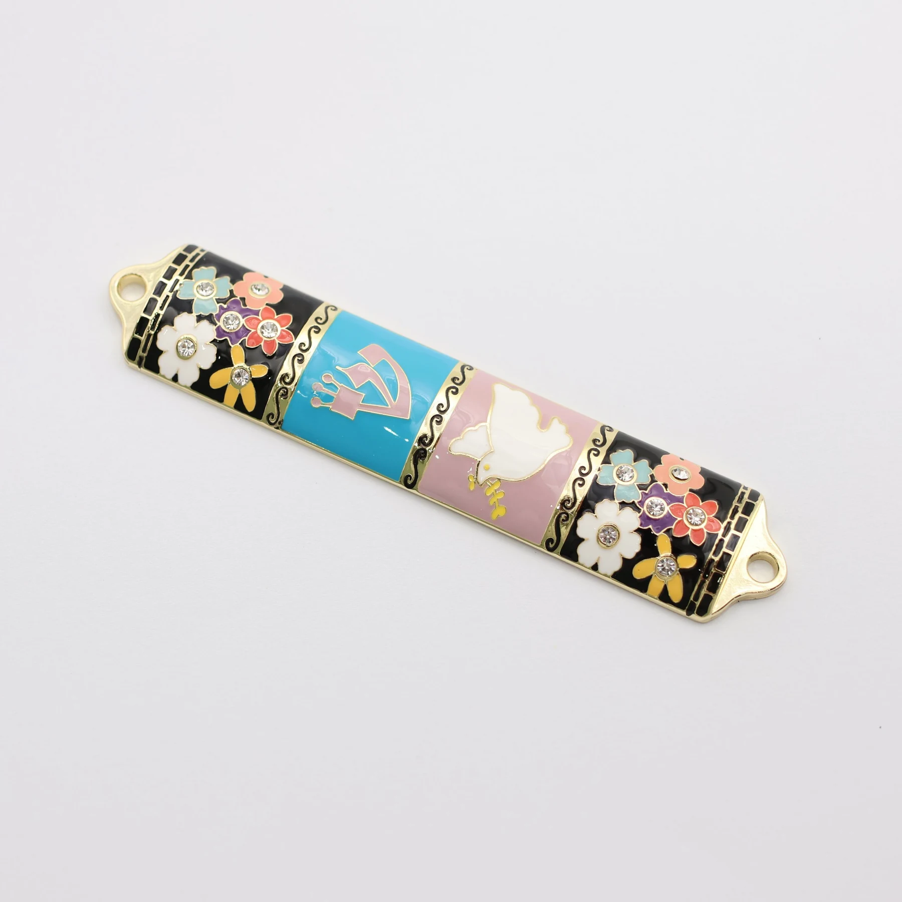 Close view of the enamel flowers and set rhinestones on the mezuzah