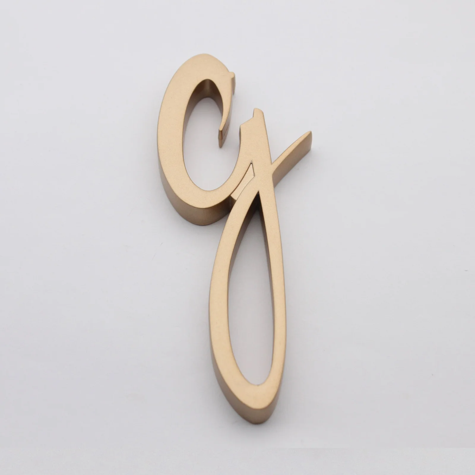 G shaped bottle opener with rubber paint finish