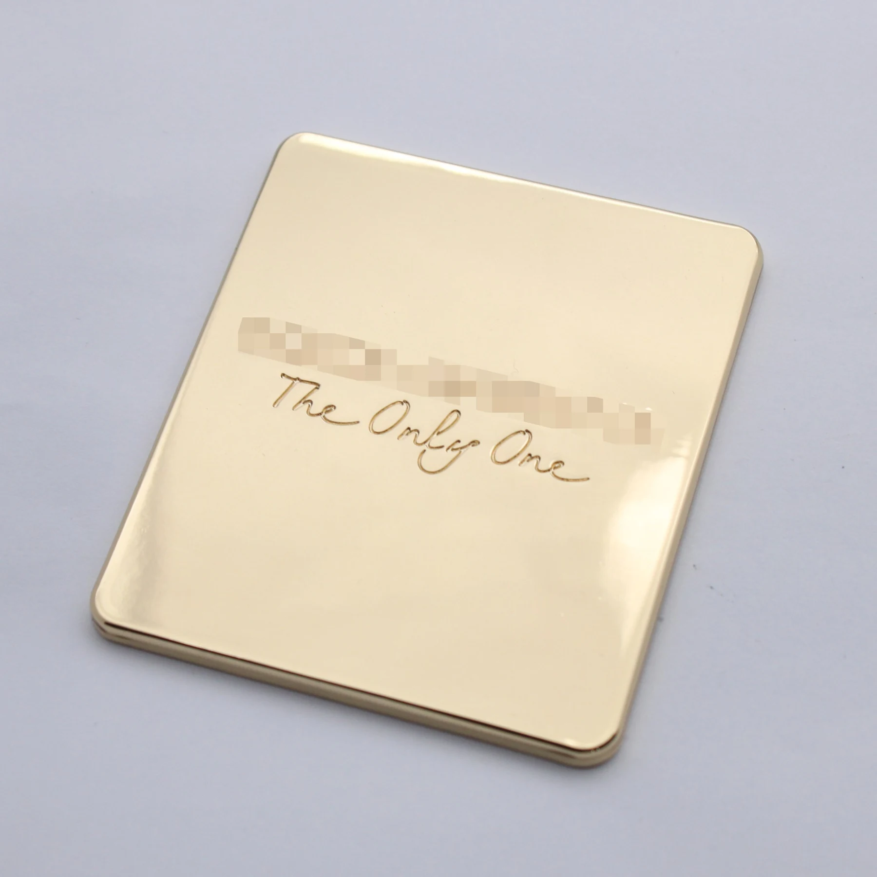 Custom engraved cosmetic mirror shown closed
