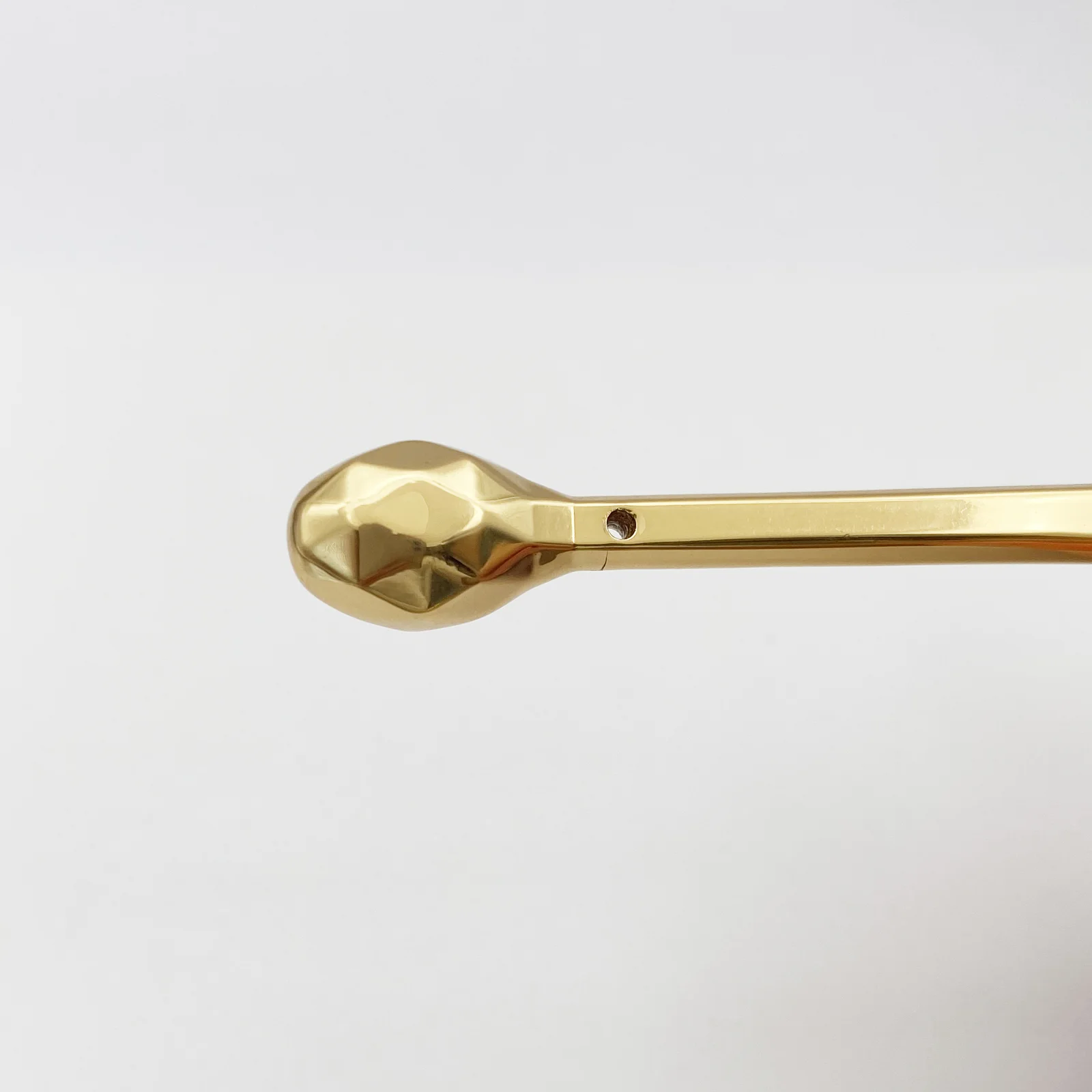 Gold metal spatulas shown as a set