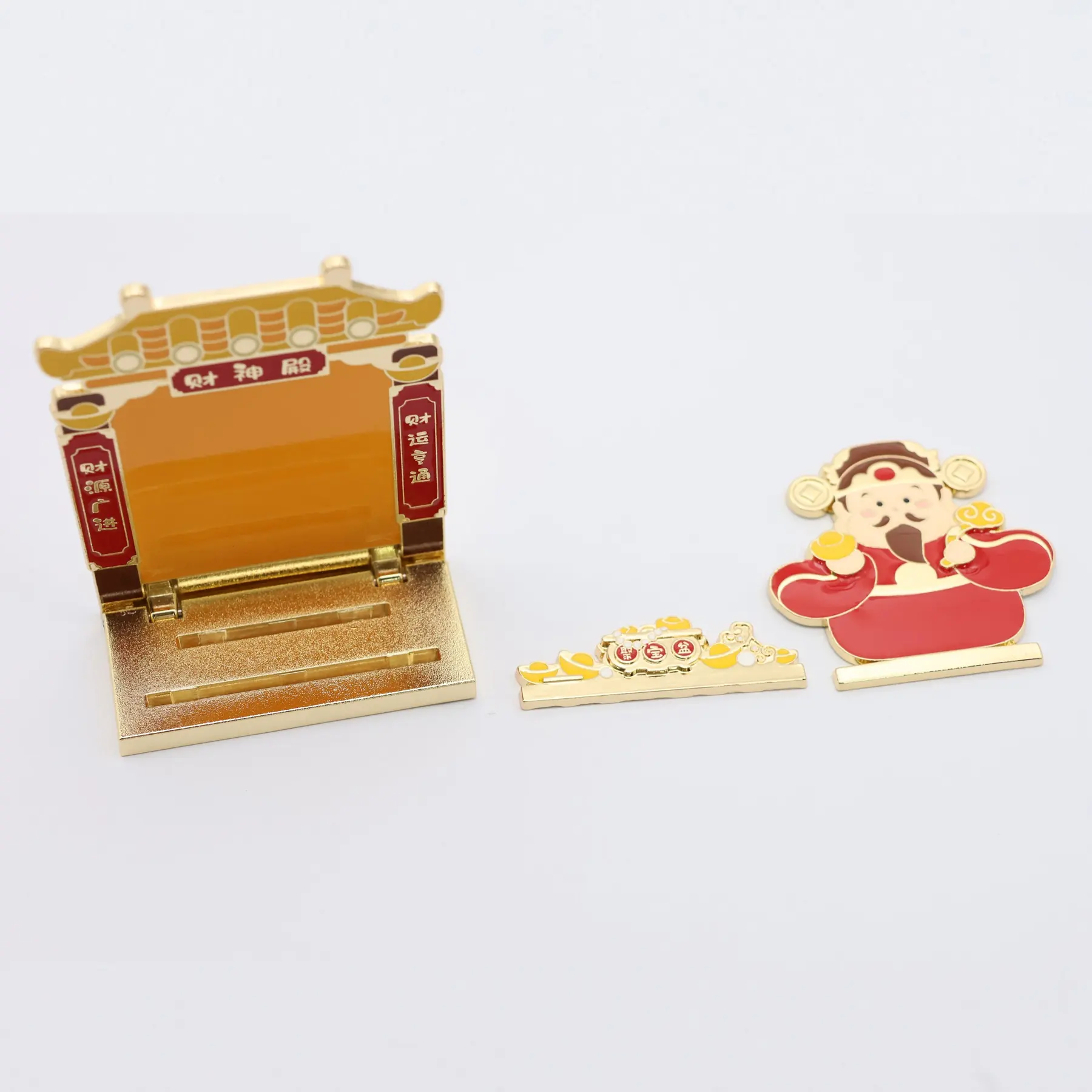Close view of the enamel detail on the Gold of Wealth figurine