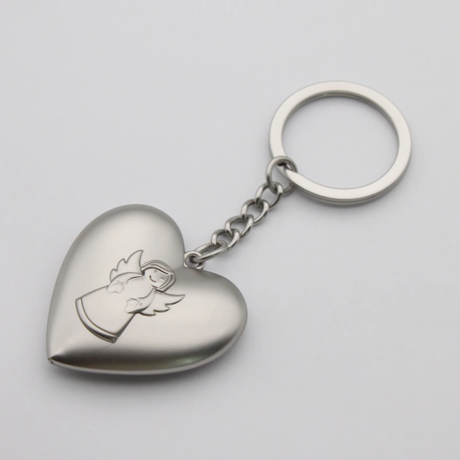 Close view of the engraved angel on the heart keyring
