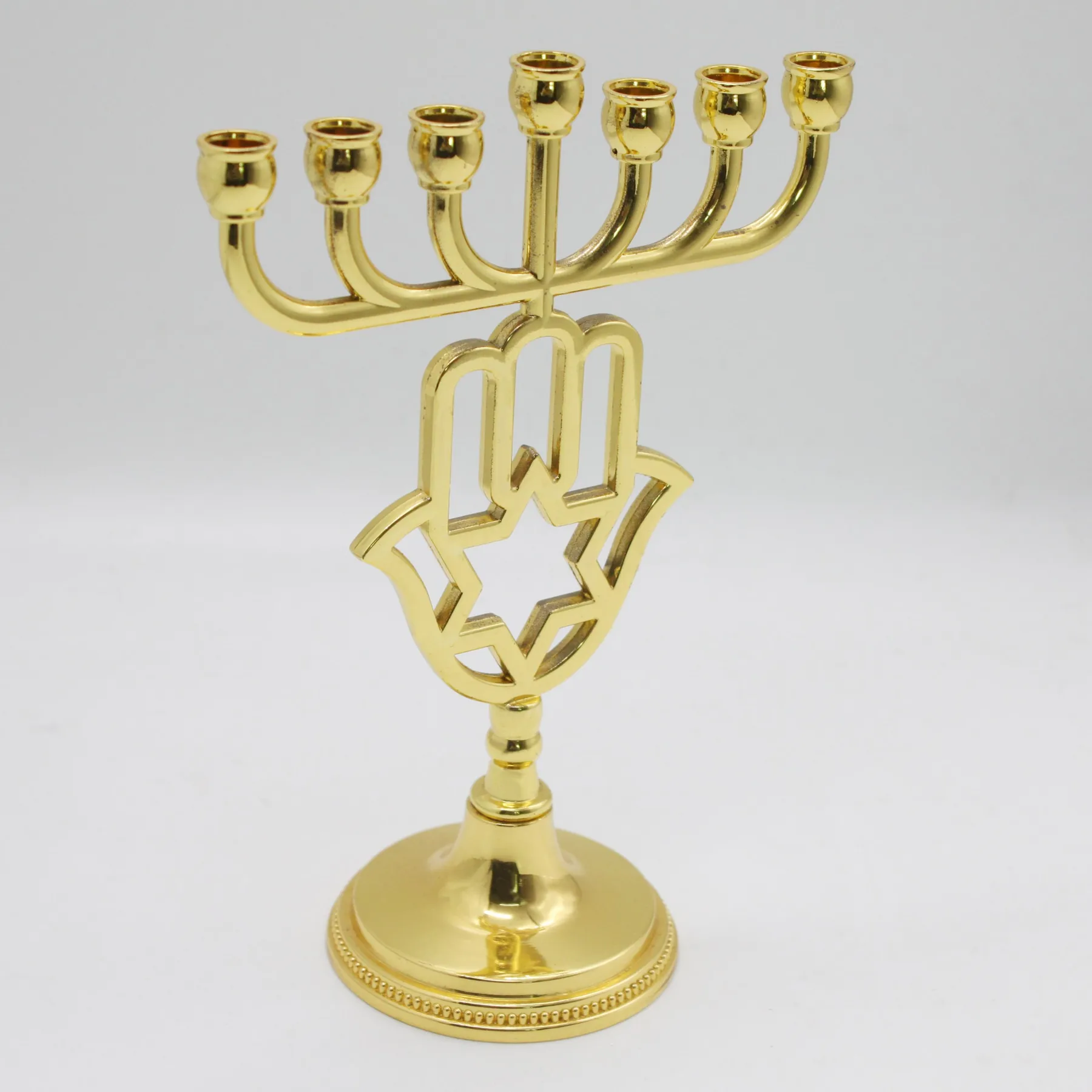 Close view of the Hamsa and Star of David cut-out on the menorah