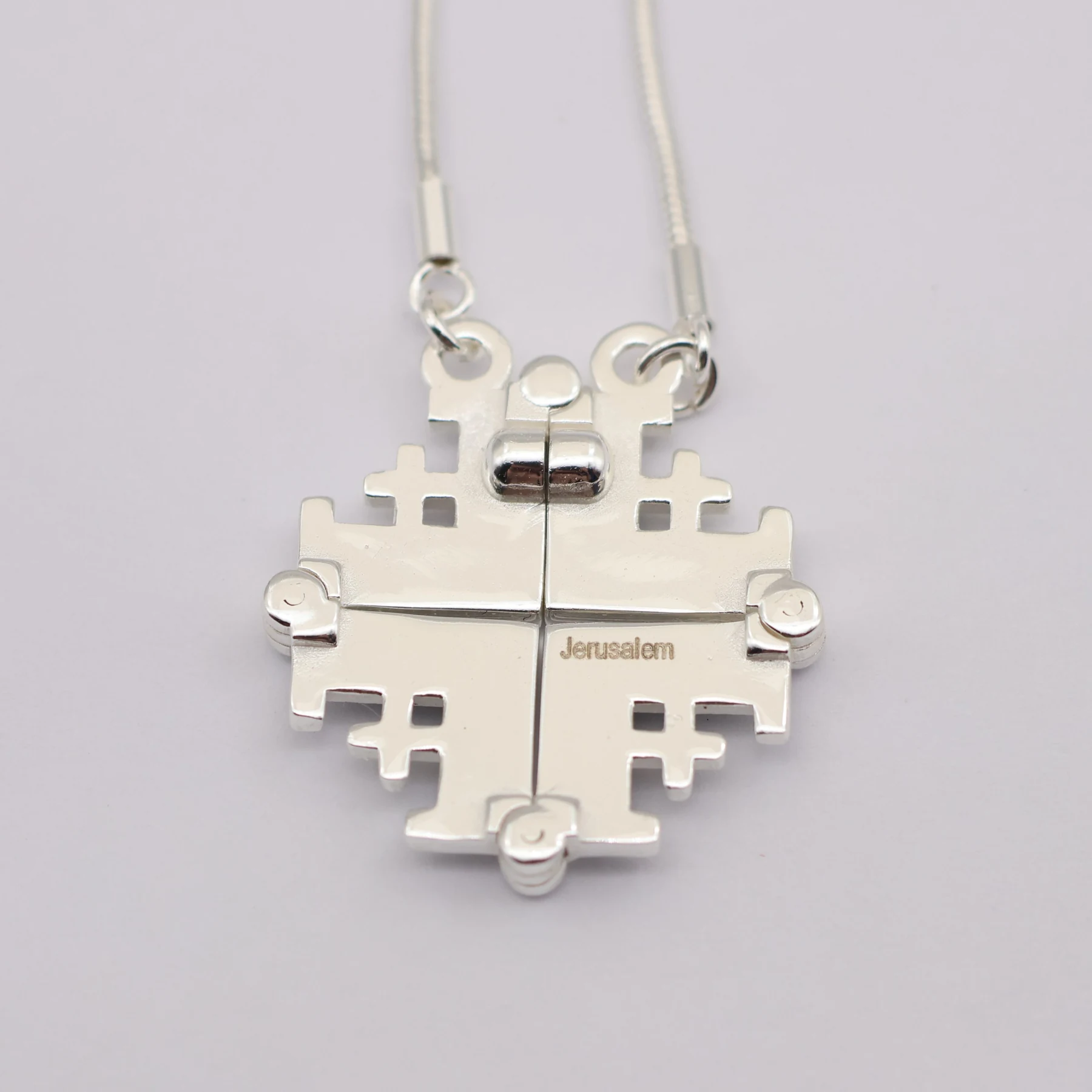 Jerusalem Cross pendant shown closed on its chain