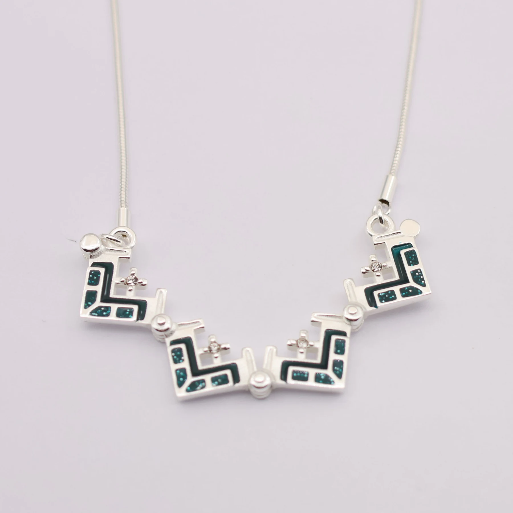 Jerusalem Cross pendant shown opened to its second configuration