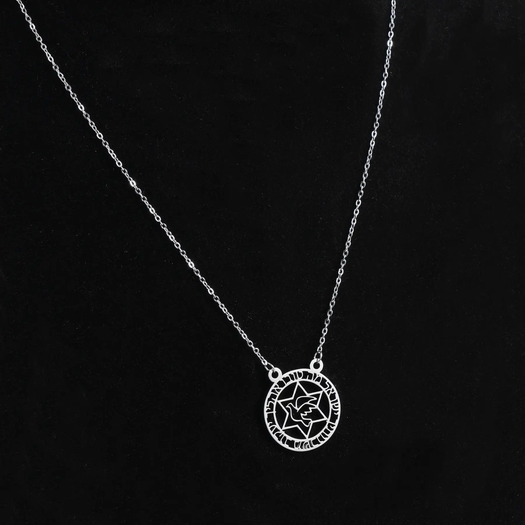 Close view of the polished Kabbalistic detail and dove symbol