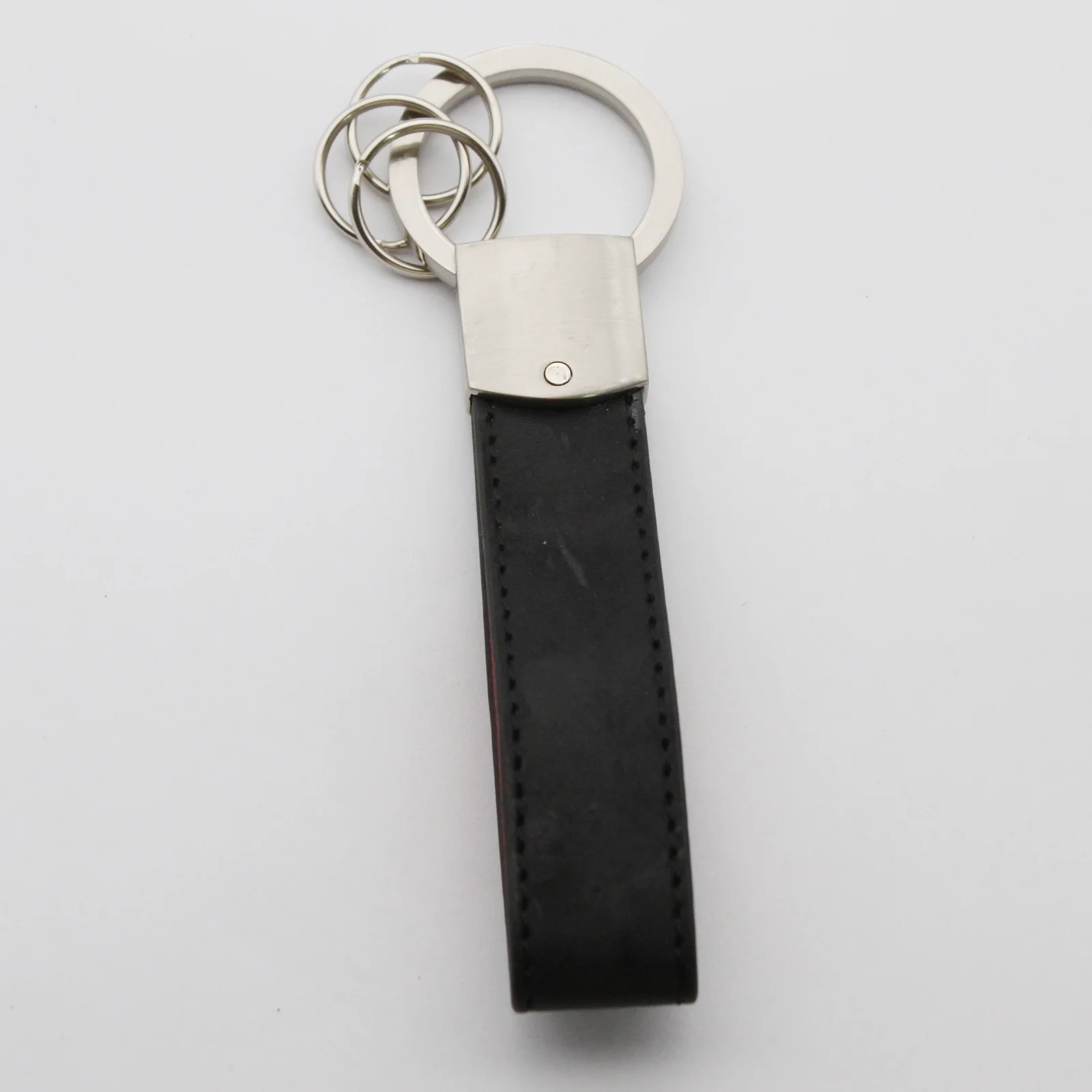 Close view of the stitching on the leather key fob