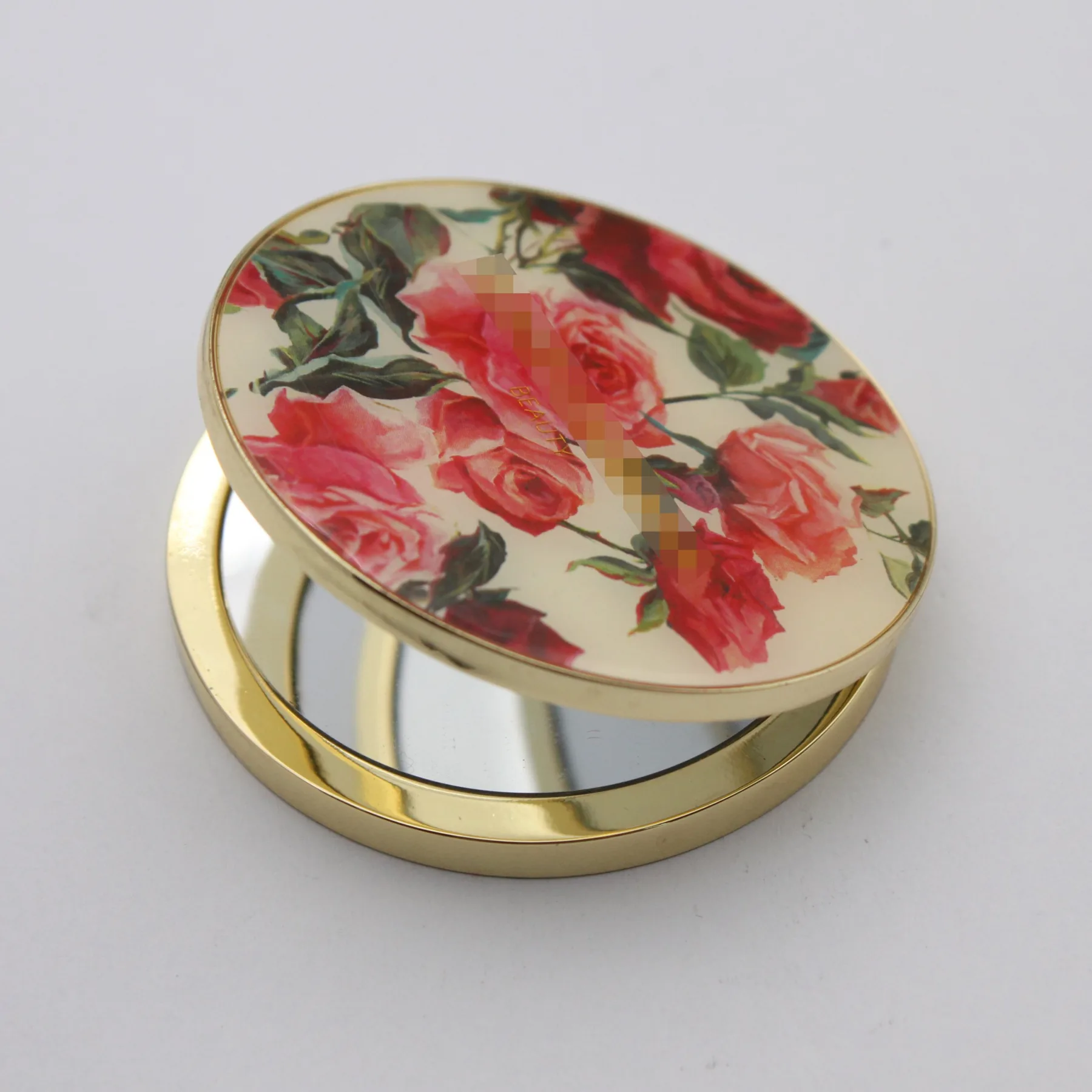 Custom metal compact mirror shown closed