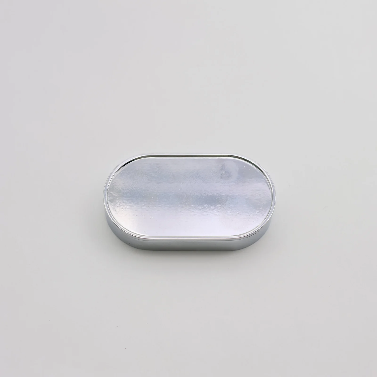 Refillable perfume case shown open with the refill pan