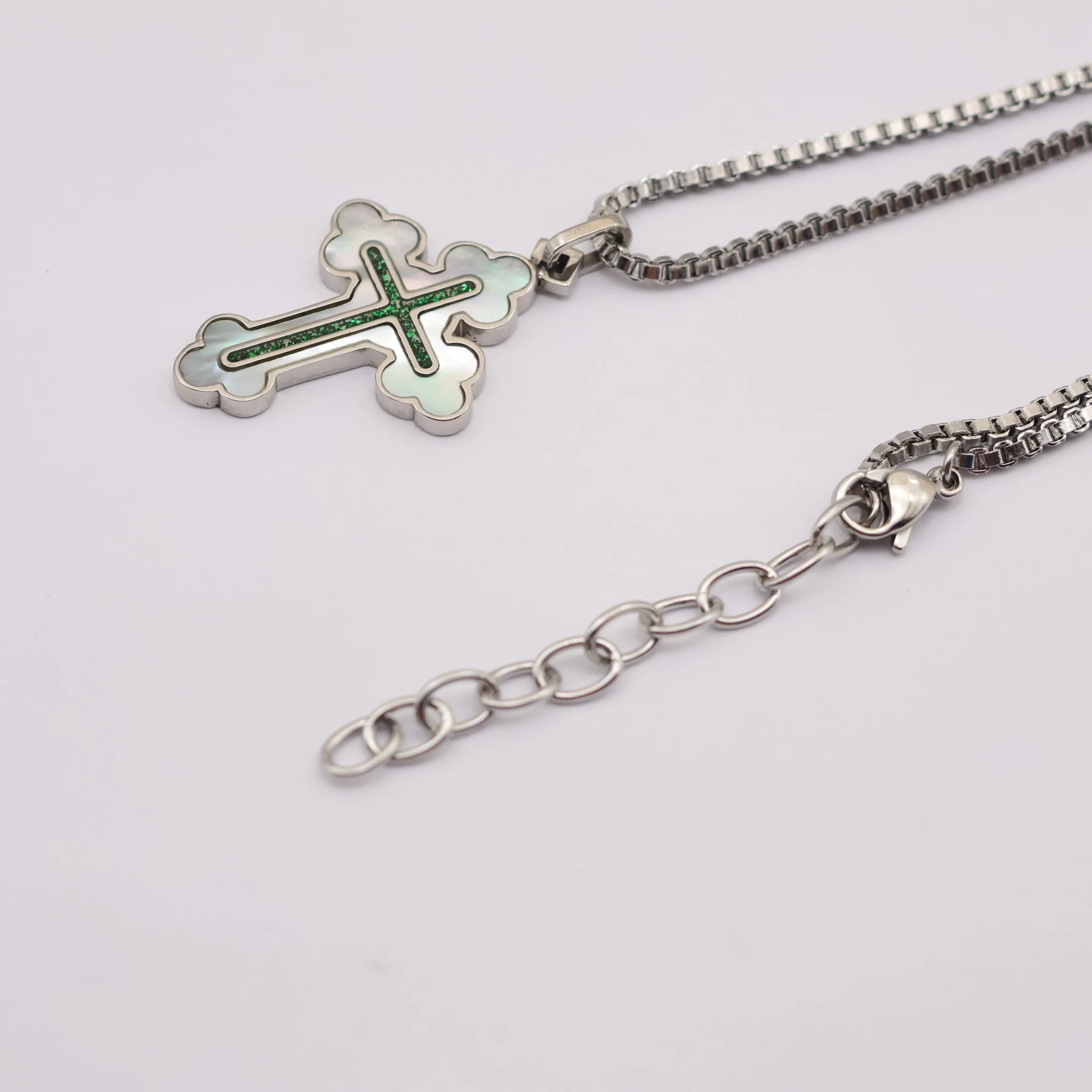 Silver cross pendant shown with its 45cm chain