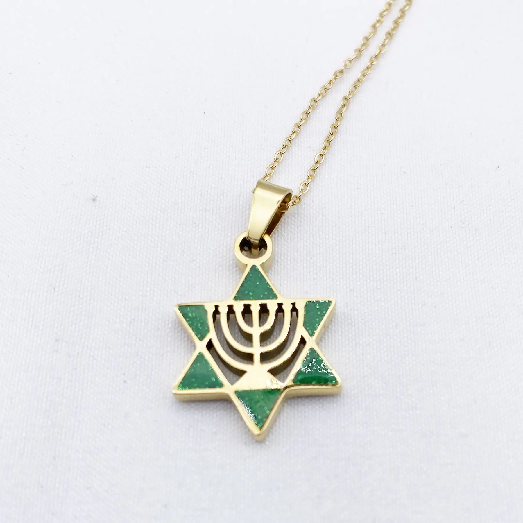 Close view of the glossy enamel on the menorah pendant