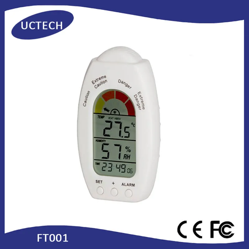 FT001 unit with lanyard, held in hand, showing temperature and humidity readings