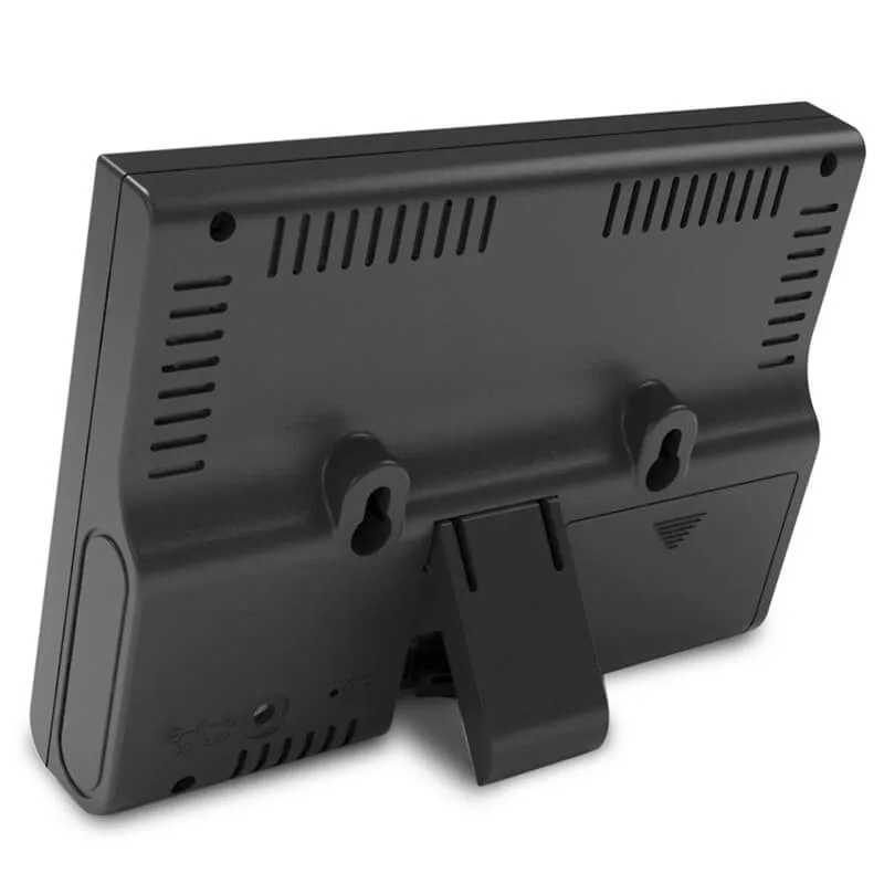 FT0852 outdoor thermo-hygrometer sensor mounted on a wall with battery compartment open