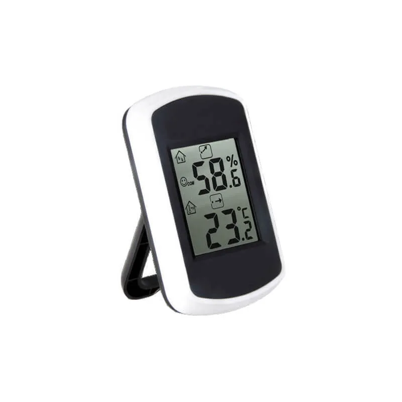 FT0042 indoor thermo-hygrometer on a desk with LCD display showing temperature and humidity