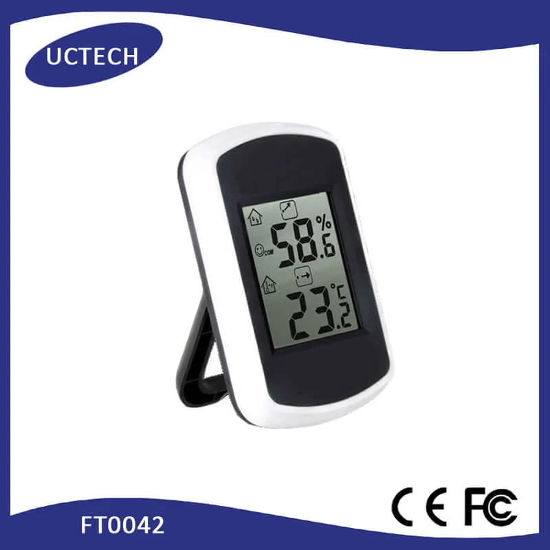 FT0042 unit mounted on a wall with built-in bracket, displaying temperature and humidity